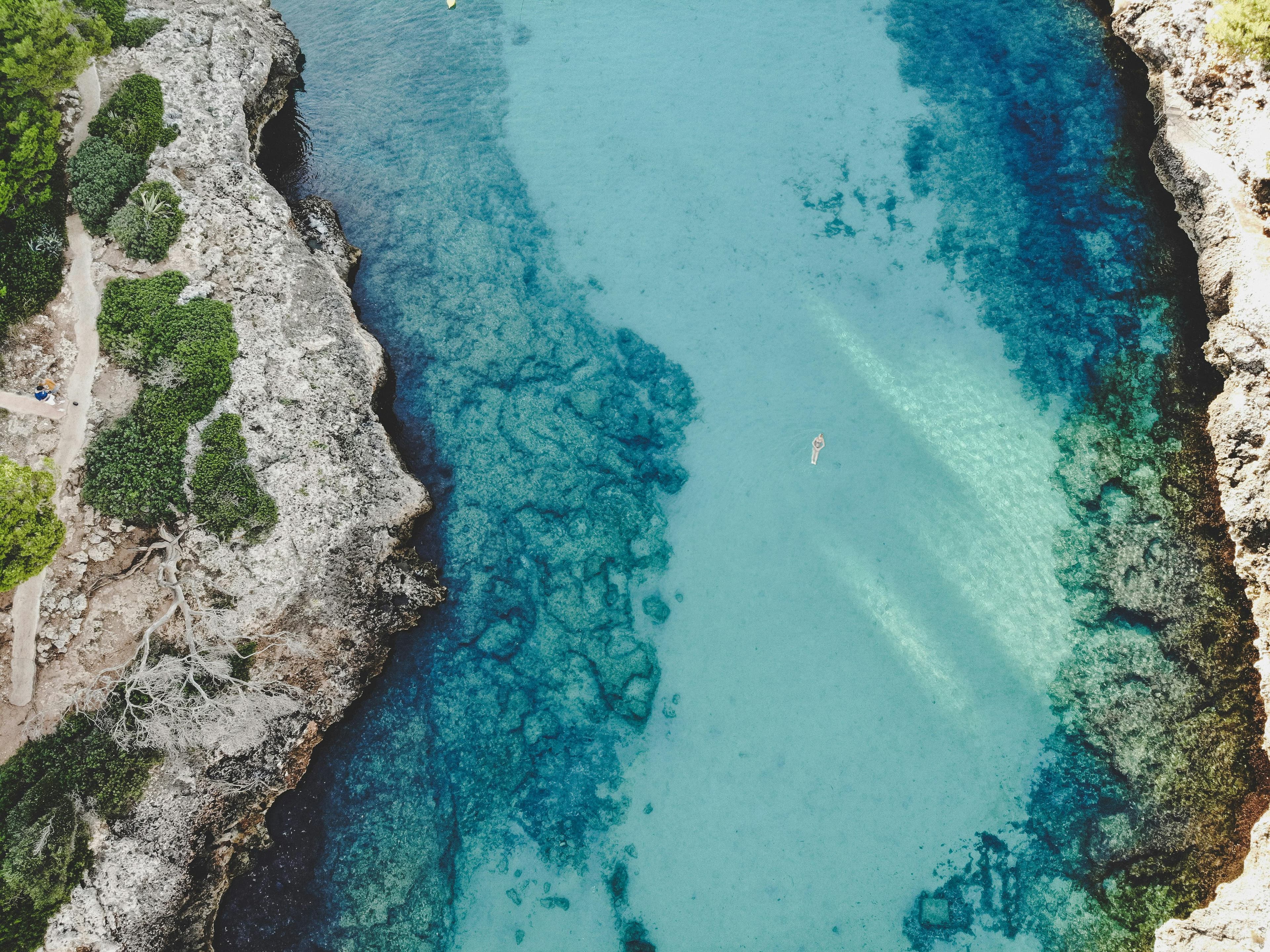 Beautiful Mallorca coastline with green mountains and blue water